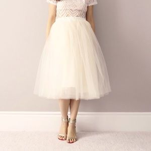 Bluish women’s cream tulle midi length skirt
